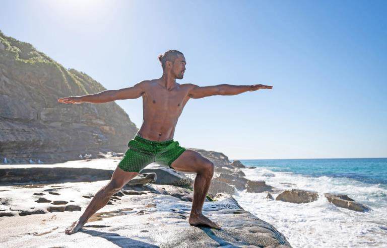 man in green shorts beach setting solaveil harmony