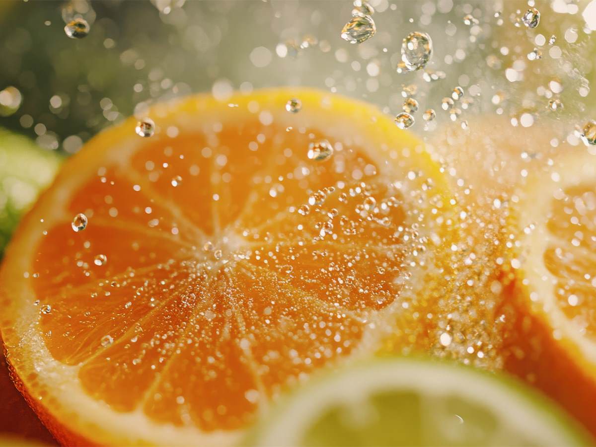 Zero Waste Sliced citrus fruit with droplets of water splashing on the slices
