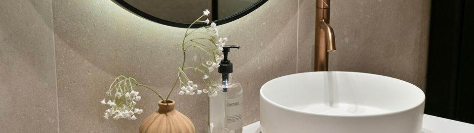 Simplified beauty rituals in bathroom, reflecting the rise of multifunctional products and skinimalism.