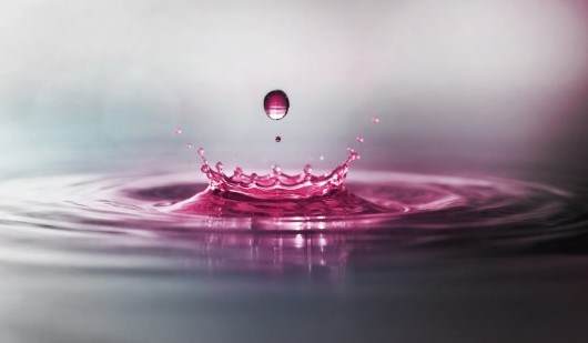 pink droplet creating a ripple representing croda beauty at in-cosmetics 2026