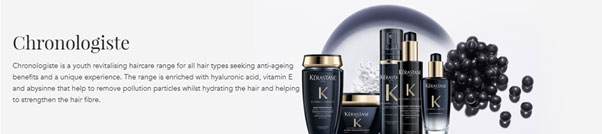 Bottles and jars for Kerastase's Chronologiste line. Every container is black with a gold lid. Pictured behind them is a plate with white powder and some black pearls.