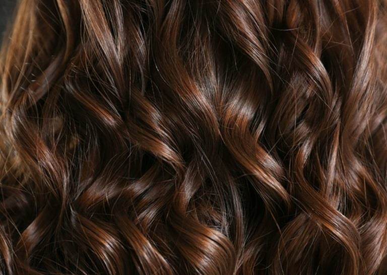 Oils in hair care Curly hair landscape 1 female white brunette hair care