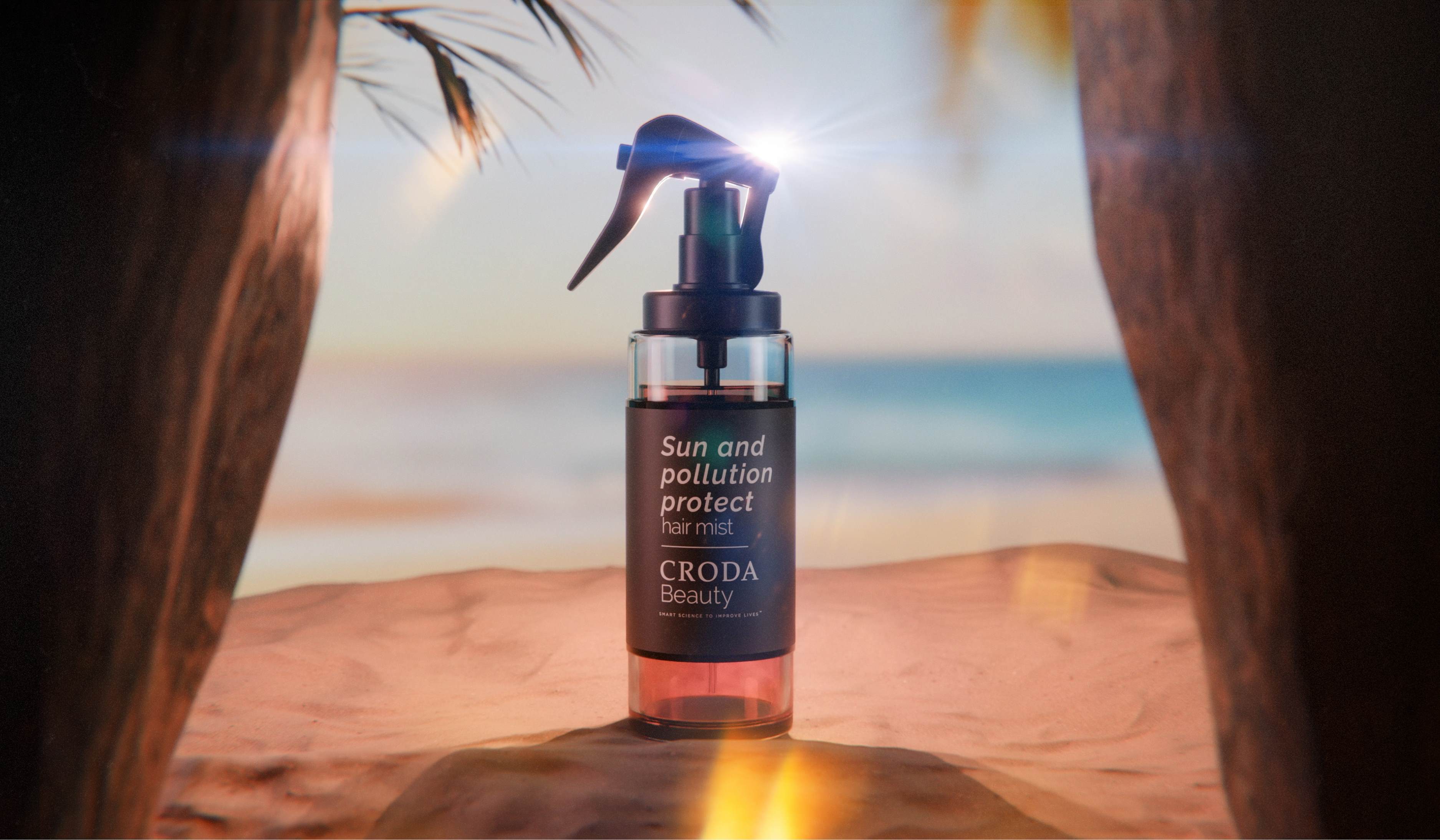 Sun and Pollution Protect Hair Mist concept formulation standing on beach with sand and sea background and palm tree branches above.