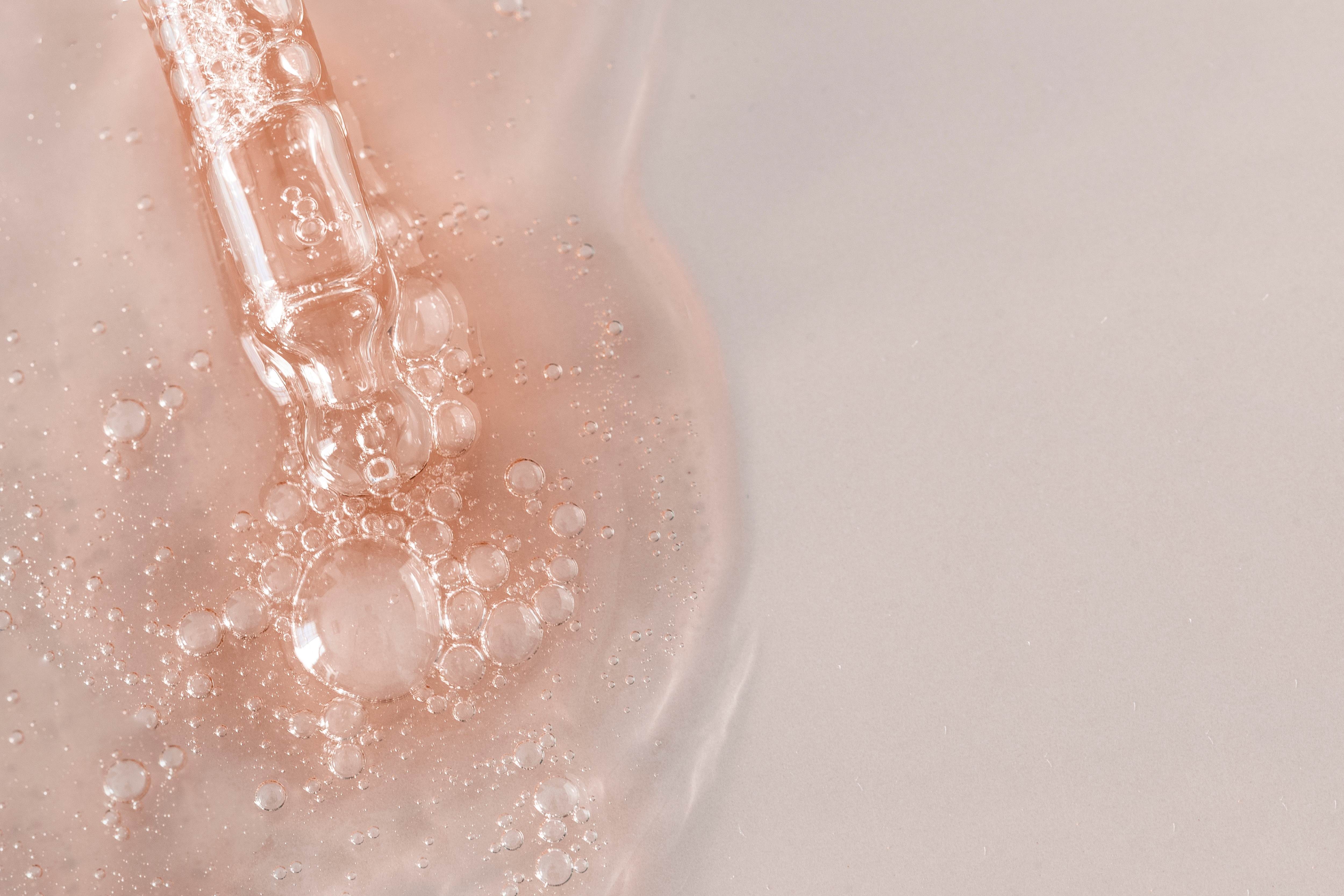 Close up on translucent bubbles in a gel.