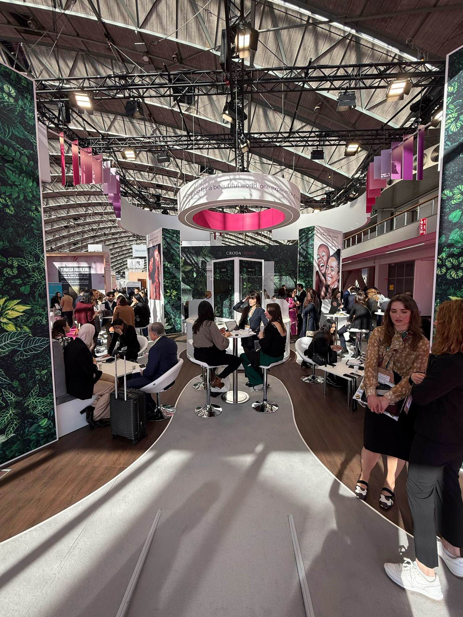 Customers chatting with experts at the Croda Beauty stand at in-cosmetics Global 2025