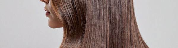 Cropped image showing the profile of a white woman with brown hair