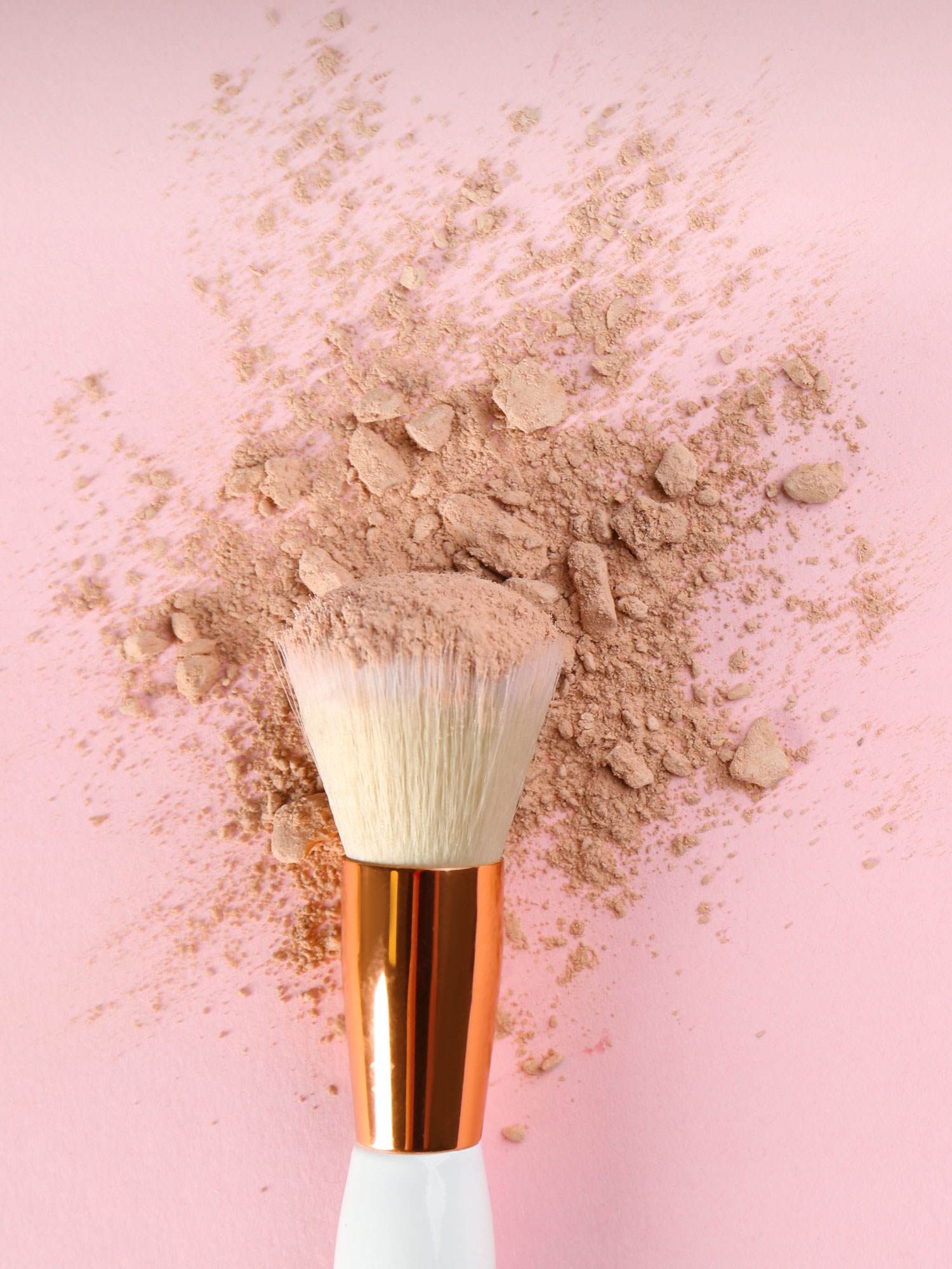 longevity face powder make up brush covered in face powder skin care