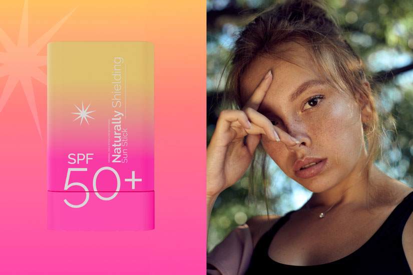 Split image. Left - Sun care formulation concept in pink and cream gradient packaging containing sun icon and formulation name ‘Naturally Shielding Sun Stick SPF 50+’. Right – Woman resting face on her hand with natural background and gentle sunlight on her freckled skin. 