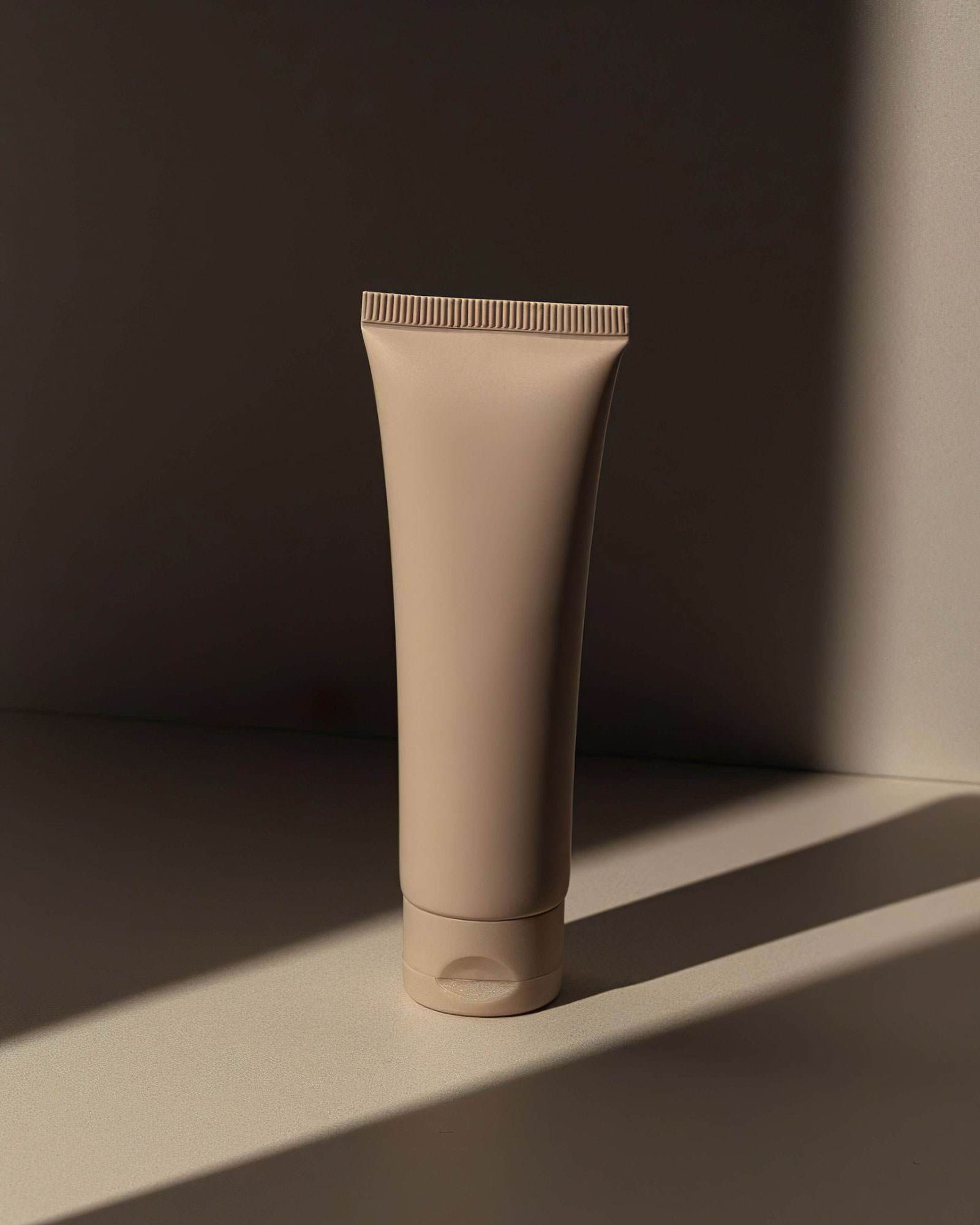 cosmetic bottle positioned on table