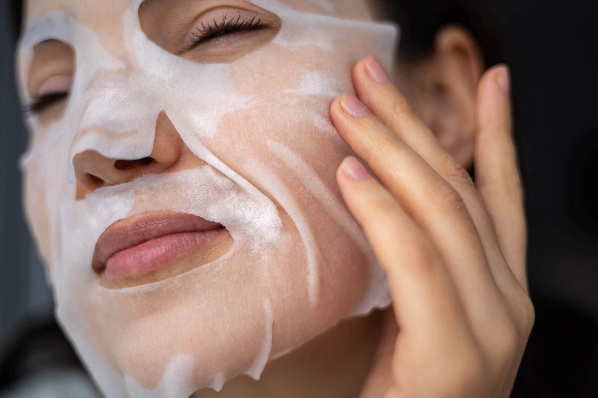Women relaxing in spa with face mask on