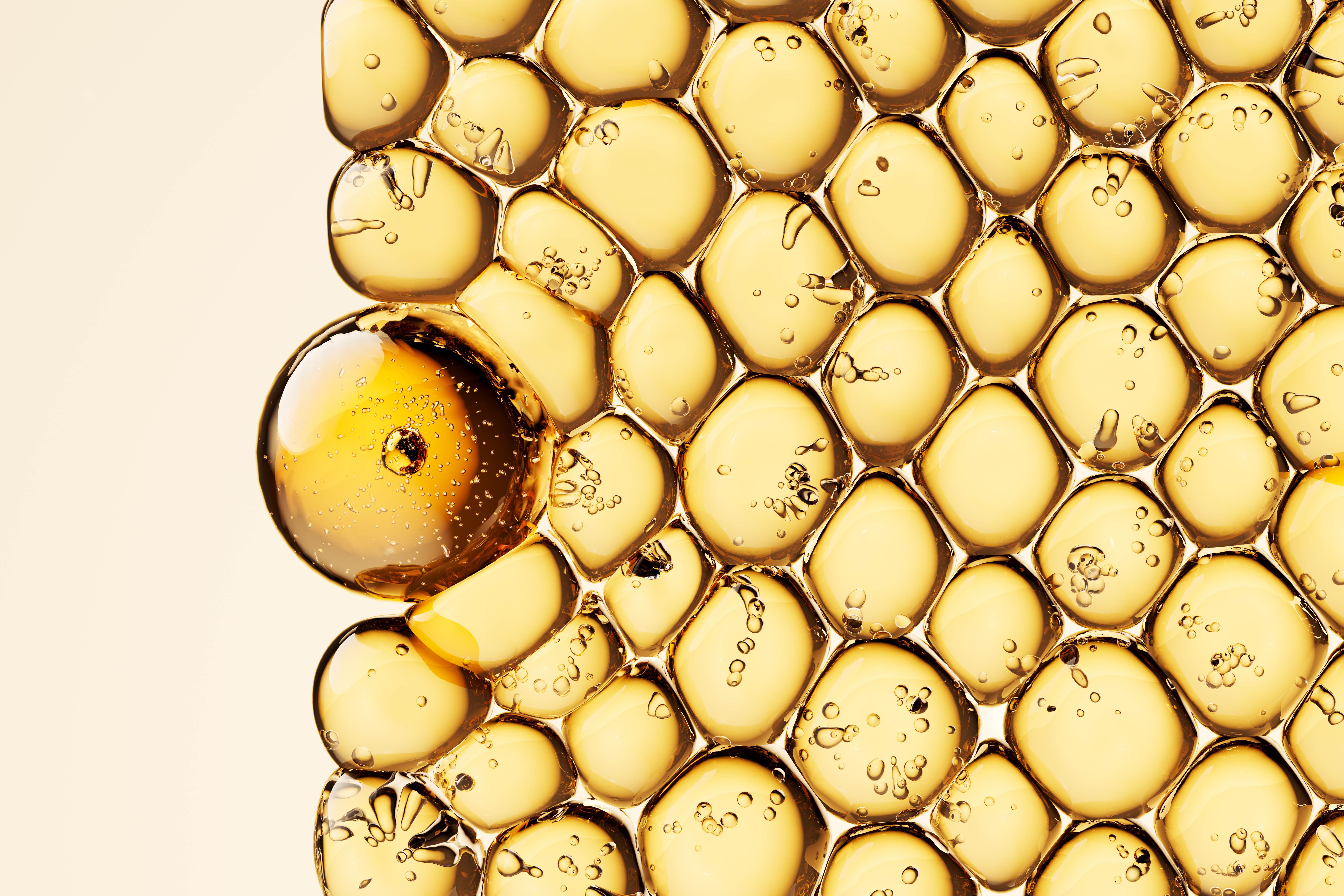 Golden oil droplets evoking themes of skincare, beauty ingredients, biotechnology, and cosmetic formulations