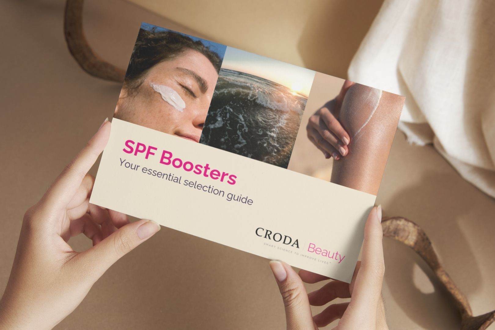 close up of hands holding spf booster selection guide, representing sunscreen formulation and SPF boosters designed for high-performance sun protection