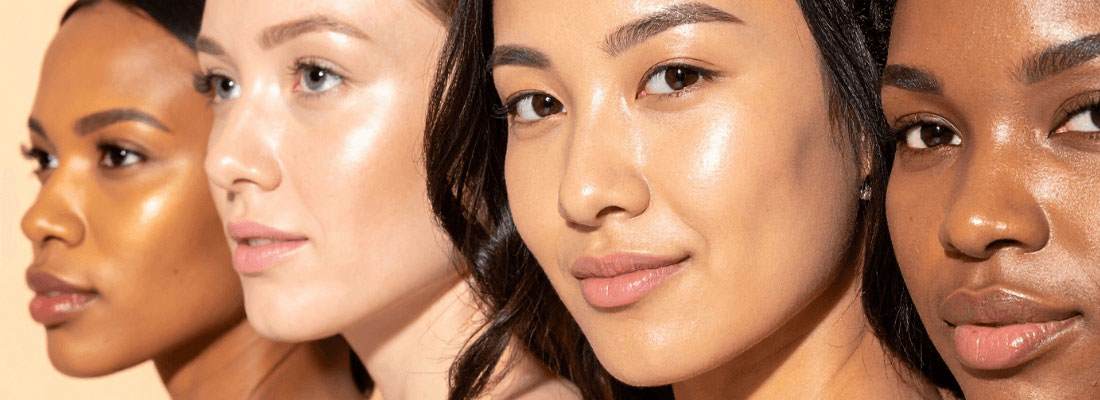 Four women with glowing, radiant skin