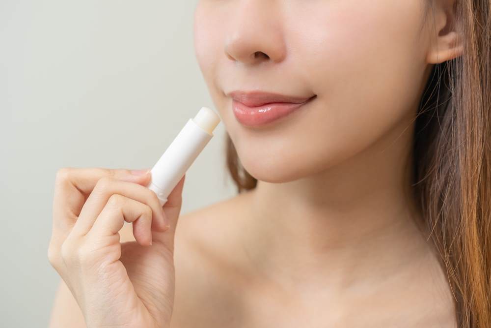 peptide plumping glossy stick cropped photo of a young woman's glossy lips