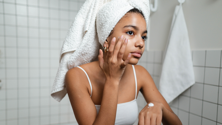 applying anti-stress facial serum