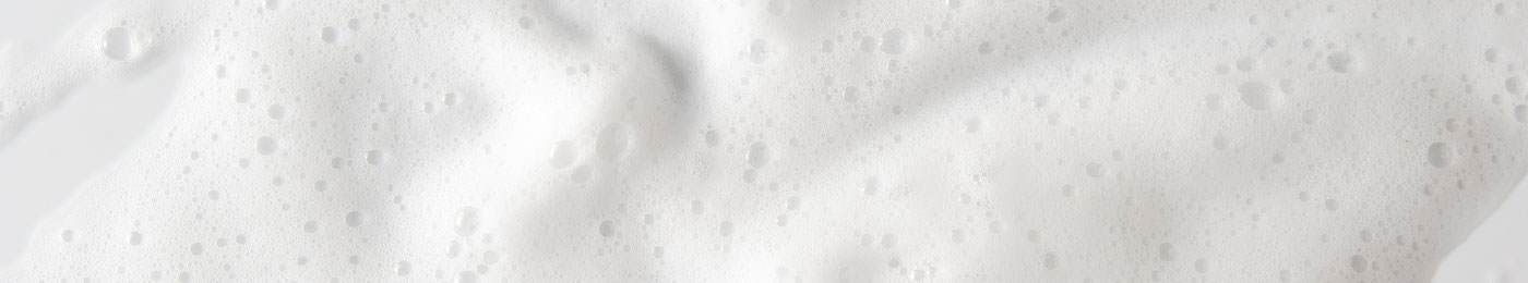 Extreme close-up on foaming white bubbles