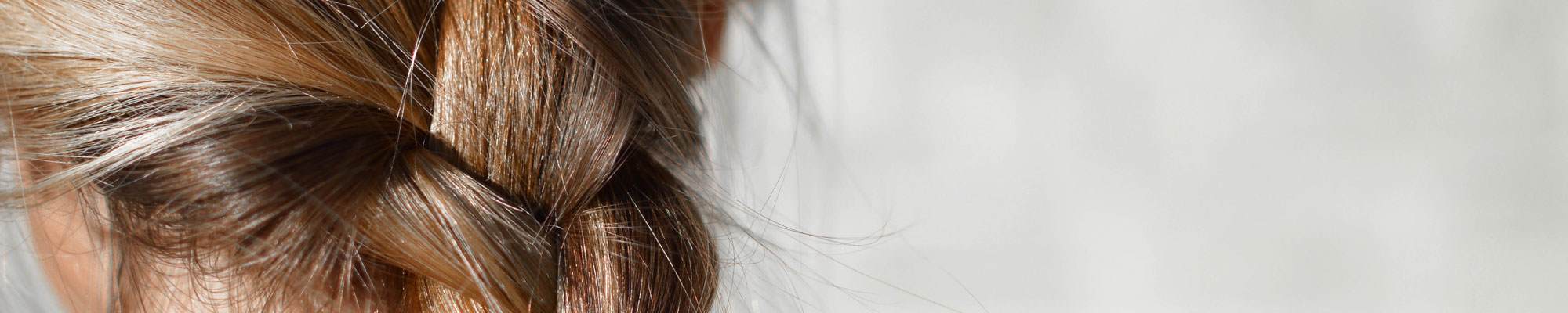 Cropped image of shiny hair. Copy reads "Shine without compromise"