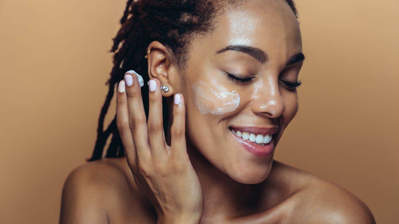 A woman enjoying the application of an energising cream