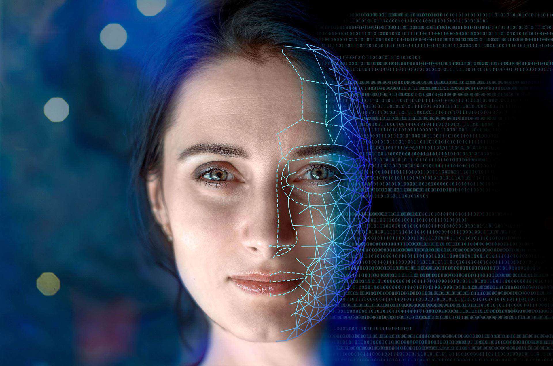 Young white woman with brown eye staring directly at the camera. One side of her face has been overlayed with a digital pattern of lines.