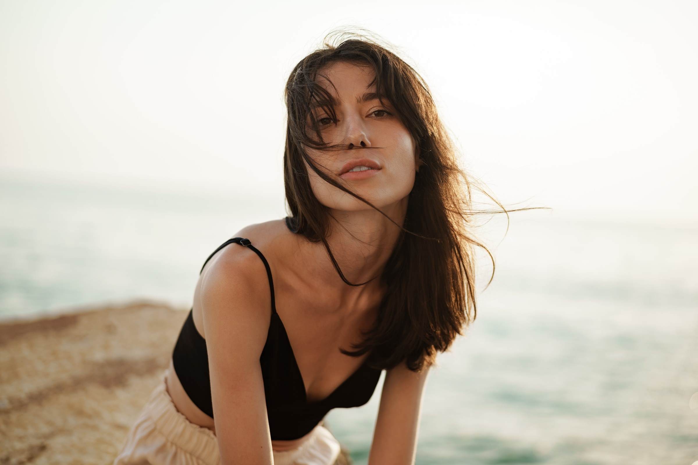 webinar Woman on beach landscape 1 female white brunette hair care				 				 				
